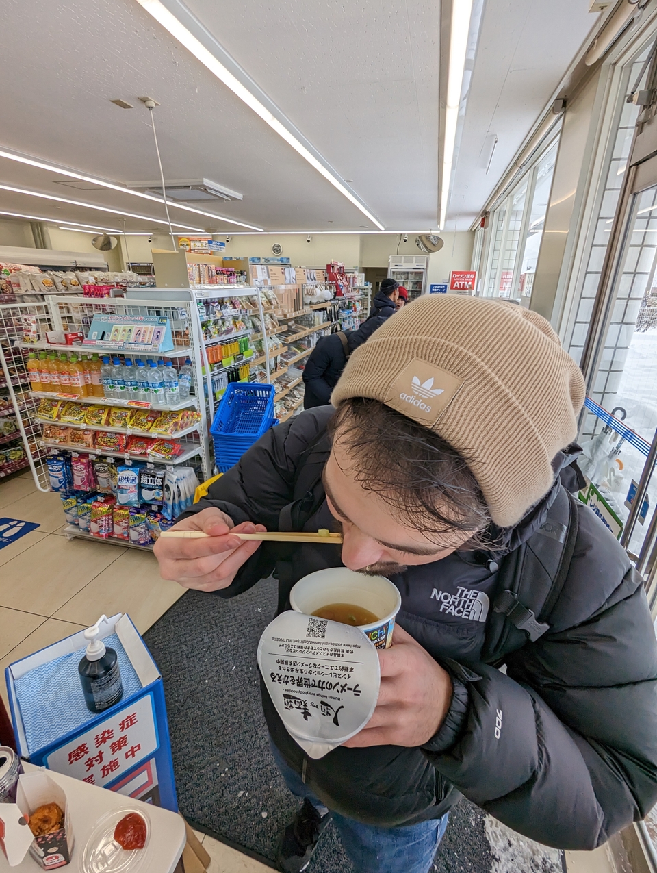 Me devouring a convenience store ramen